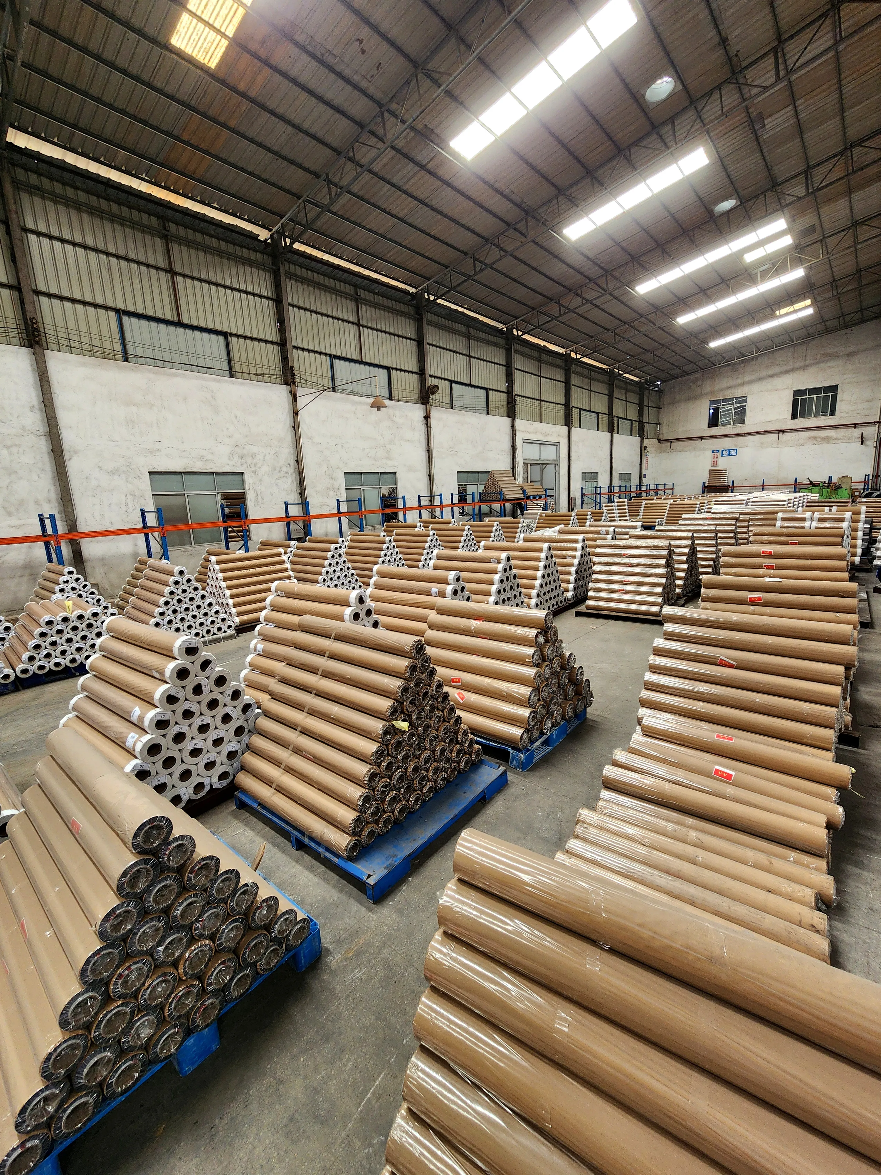 Warehouse floor — packed rolls inside the workshop
