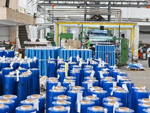 Production equipment and blue finished rolls in the workshop